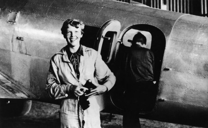 Amelia Earhart standing by her Lockheed Electra in Natal, Brazil, in June 1937. Her plane vanished over the Pacific less than a month later.